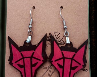 May include: A pair of red and black geometric fox head earrings with silver-colored ear wires. The earrings are displayed on a brown card with the text "Kustom Made Creations" and an email address.