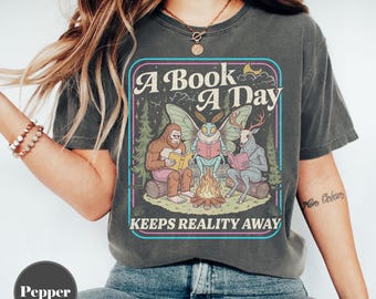 A Book A Day Keeps Reality Away PNG, Funny Book Addict Png, Cryptid Books Club Tee, Retro Bookish Graphic Gift