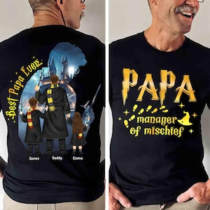 May include: Black t-shirt with a silhouette of a wizard and two children. The text "Best Papa Ever" is on the left side of the shirt. The text "PAPA manager of mischief" is on the right side of the shirt.