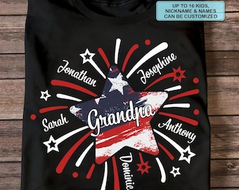 May include: Black t-shirt with a patriotic star design. The star features the word "Grandpa" and is surrounded by names and fireworks in red, white, and blue. Text on the shirt reads "Up to 16 kids, nickname & names can be customized."