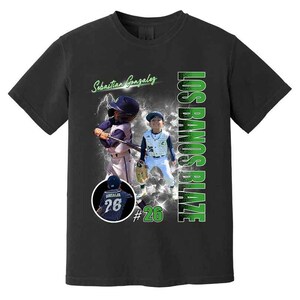 May include: Black t-shirt featuring baseball player images and text. The shirt displays the name "Sebastian Gonzalez" in green script, along with "LOS BANOS BLAZE" in green vertical text. A player is shown batting, and another is standing, wearing a baseball uniform.