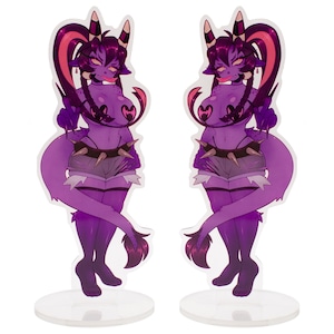May include: Two purple cartoon figures with horns, a spiked collar, and shorts. The figures have a tail and are standing on clear circular bases. The figures are in a suggestive pose.