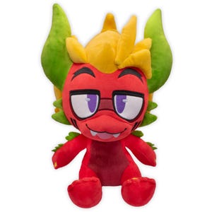 Puede incluir: Un peluche que representa una criatura roja con detalles amarillos y verdes. El juguete tiene grandes ojos enmarcados en púrpura, una boca sonriente y una cabeza puntiaguda. La criatura está sentada con las piernas extendidas.