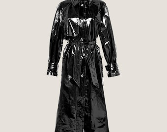 May include: A long black patent leather trench coat with a belt and pockets.