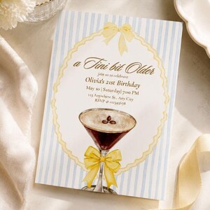 May include: A rectangular birthday invitation card with light blue vertical stripes, featuring a central scalloped frame, a yellow bow, and an illustration of an espresso martini with three coffee beans. Text reads: a Tini bit Older, Olivia's 21st Birthday, May 10, Saturday, 7:00 PM, 123 Anywhere St., Any City, RSVP @ +12345678.