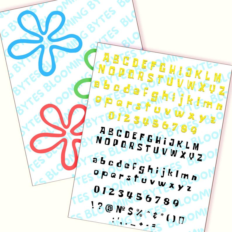 May include: A sheet of paper with a yellow alphabet, numbers, and punctuation marks printed in a bold, blocky font. The letters are outlined in black. The paper is on a white background.