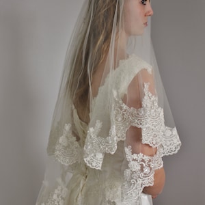 Lace veil in two layers fingertip with beaded wide lace and second tier could be used as a blusher, two tier lace veil with silver or gold