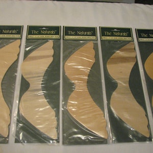 May include: Five packages of unfinished wooden butterfly wings, each labeled "The Naturals" with the size "12" x 12"  and "Hand Wooden Whole Ring".