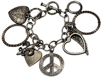Pulsera vintage plateada con dijes de alas de corazón de la paz, joyería de moda para mujer