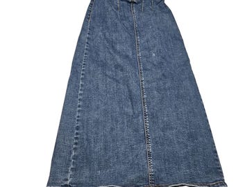 May include: A long, blue denim skirt with a classic design. The skirt features a button and zipper closure, a split in the back, and a faded wash. The skirt is made of a durable denim material.