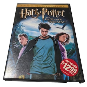 Puede incluir: Una carátula de DVD de "Harry Potter y el Prisionero de Azkaban" con el título de la película y los personajes. La portada muestra a Harry, Ron y Hermione frente a un castillo. Una pegatina roja indica que el DVD es de segunda mano.
