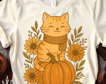 May include: Cream-colored t-shirt featuring a smiling orange tabby cat wearing a scarf, sitting atop a pumpkin. The cat is surrounded by orange sunflowers and autumn leaves. A cute and cozy design for fall.