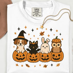 Retro Halloween shirt featuring pets in jack-o’-lanterns with stars and autumn leaves
