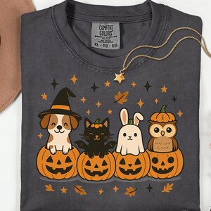 Cute Halloween PNG design with dog, cat, bunny, and owl inside pumpkins, cozy fall vibe