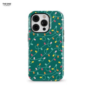 May include: A teal phone case with a repeating pattern of colorful Christmas lights. The lights are in shades of red, yellow, orange, and pink, with white squiggly lines connecting them. The top left corner has the text "THE ONE -CASE-".