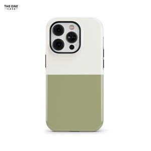 May include: A two-tone phone case with a white top and a sage green bottom. The case has a black camera module and the text "THE ONE CASE" in the upper left corner.