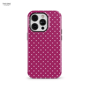 May include: A magenta phone case with a white polka dot pattern. The case has a glossy finish and a camera cutout. The brand name "THE ONE CASE" is printed in the top left corner.