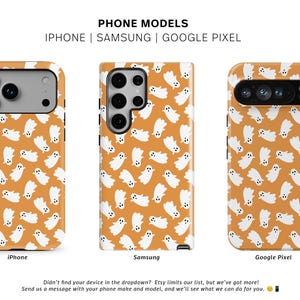 May include: Three phone cases with a repeating pattern of white ghosts on an orange background. The cases are for iPhone, Samsung, and Google Pixel models. The text "PHONE MODELS" and the brand name "THE ONE CASE" are visible.