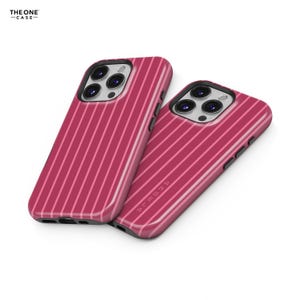 May include: Two pink phone cases with a striped design. The cases have a glossy finish and a camera cutout. The text "ANGELA" is printed on one of the cases. The logo "THE ONE CASE" is in the top left corner.