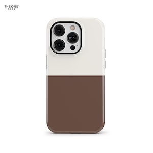 May include: A two-tone phone case, white at the top and brown at the bottom. The case features a camera cutout with three lenses and a flash. The brand name "THE ONE CASE" is printed in the top left corner.