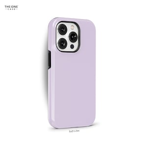 May include: A soft lilac phone case with a black border and a camera cutout. The case is made of a smooth, matte material. "Soft Lilac" is printed below the case.