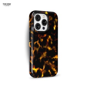 May include: A black phone case with a tortoiseshell pattern. The case has a raised camera bump with three lenses.