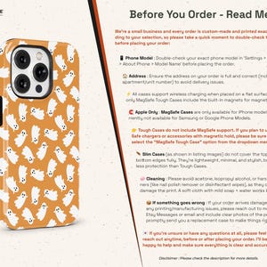 May include: A phone case with a repeating pattern of white ghost illustrations on an orange background. The case has a glossy finish and a black camera module. The text "THE ONE -CASE-" is in the upper left corner.