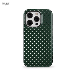 May include: A green phone case with white polka dots. The case has a raised camera bump with three lenses.