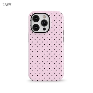 May include: A pink phone case with a black polka dot pattern. The case has a glossy finish and a black border. The top left corner of the case has the text "THE ONE -CASE-".