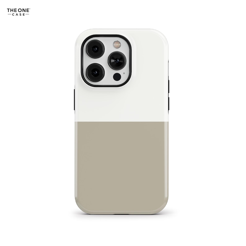 May include: A two-tone phone case with a white top and a tan bottom. The case has a black camera lens protector and the brand name "THE ONE CASE" printed at the top left.