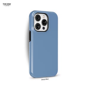 May include: A dusty blue phone case for an iPhone with a camera bump and a black border.