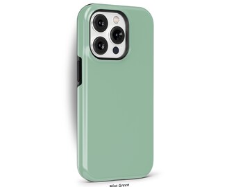 May include: A mint green phone case with a black border and a silver camera lens. The case is designed for a phone with a triple camera system. The text "THE ONE -CASE- " is printed at the top of the image.