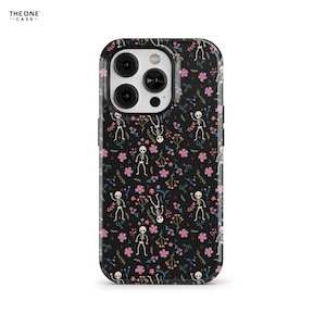 May include: Black phone case with a floral and skeleton pattern. The case features a repeating design of white skeletons, pink flowers, and green leaves on a black background. The brand name "THE ONE CASE" is printed in white on the top left corner.