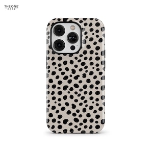 May include: A phone case with a beige background and a pattern of black spots. The case has a glossy finish and a cutout for the camera. The brand name "THE ONE CASE" is printed in black at the top left.