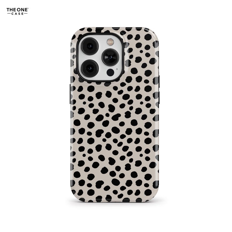 May include: A phone case with a beige background and a pattern of black spots. The case has a glossy finish and a cutout for the camera. The brand name "THE ONE CASE" is printed in black at the top left.