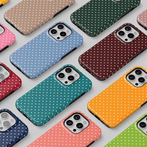 May include: A collection of colorful phone cases with a polka dot pattern. Cases are in various colors, including pink, blue, green, and yellow. The cases have a glossy finish and a black border. The brand name "THE ONE CASE" is visible in the top left corner.