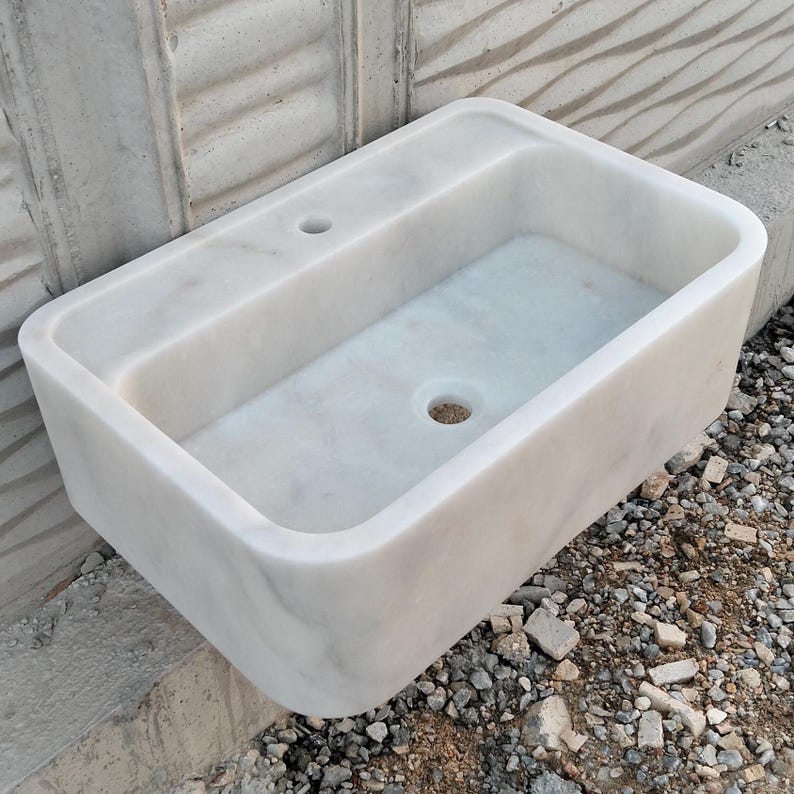 Luxurious Carrara marble sink with a polished finish, adding sophistication to any space.