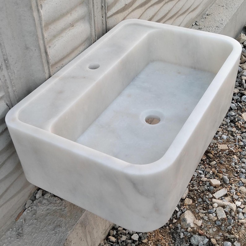 Custom-designed Carrara marble sink, blending timeless style with modern functionality.