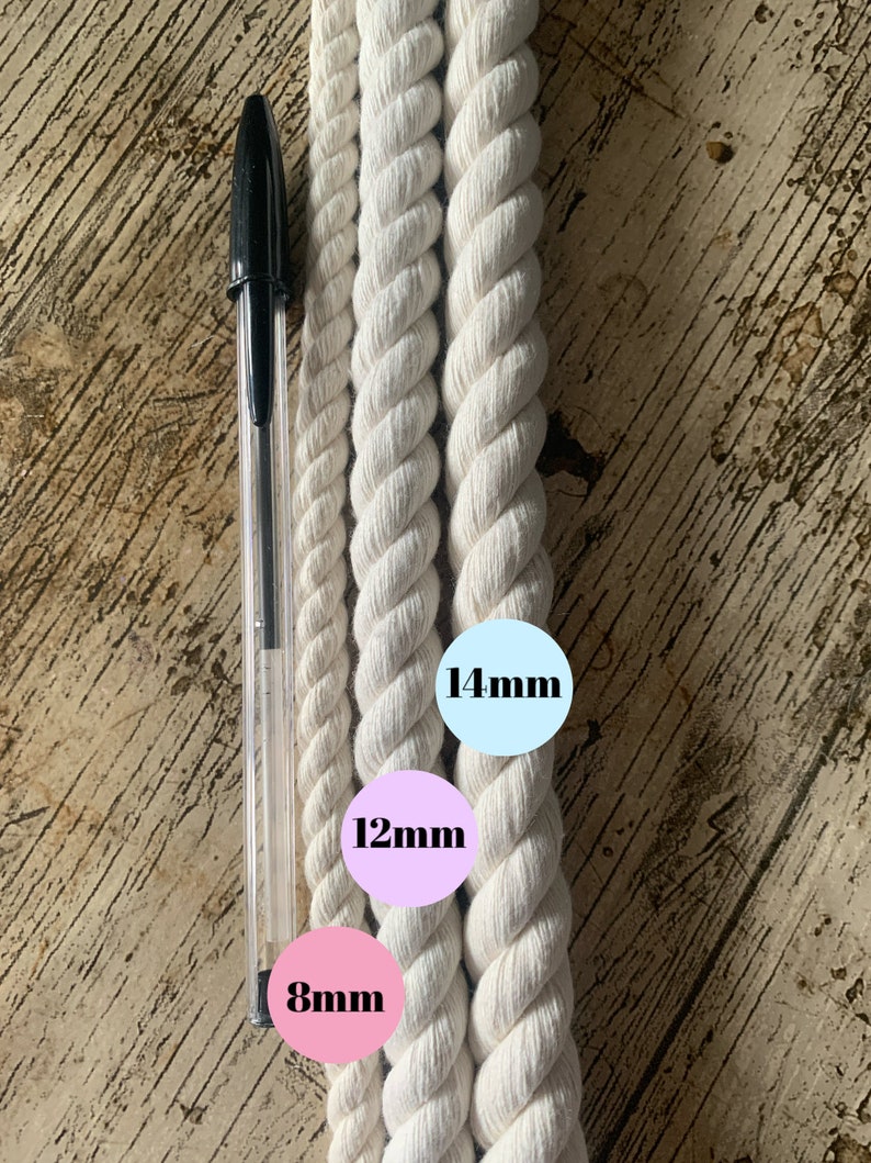 May include: Three white cotton ropes of different thicknesses, measured in millimeters. The ropes are laid out side-by-side on a wooden surface. The smallest rope is 8mm, the middle rope is 12mm, and the largest rope is 14mm.