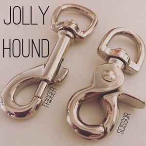 May include: Two silver metal trigger clips, one labeled "TRIGGER" and the other labeled "SCISSOR".