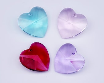 May include: Four crystal heart-shaped charms in different colors: light blue, light pink, red, and purple.