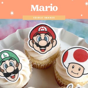 May include: Cupcakes topped with edible images of Mario, Luigi, and a mushroom character. The cupcakes sit on a white plate against a colorful background. The word "Mario" is displayed above the cupcakes.