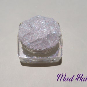 MAD HATTER - Sparkly Fine Eye Glitter Mineral Eyeshadow Shimmer Highlighter. Viewed in a single jar with name of eyeshadow in the corner in fancy purple font.