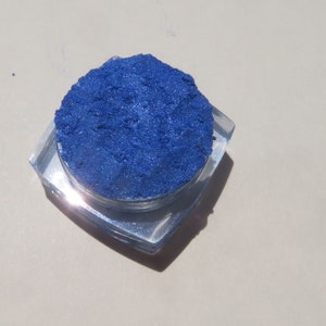 May include: A small container of blue cosmetic glitter.