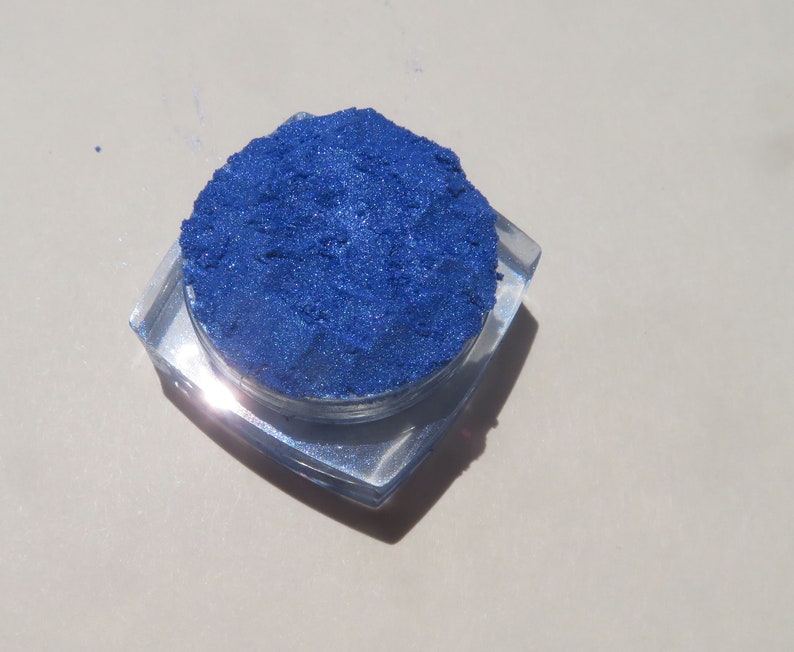 May include: A small container of blue cosmetic glitter.