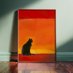 May include: A black cat silhouette sits on a red, orange, and yellow sunset background. The cat is facing right and looking to the right. The painting is framed in a brown frame.