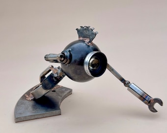 Salvaged Metal Racer Robot Sculpture: Upcycled Bell & Howell Lens Art