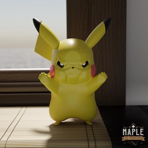 May include: A yellow Pikachu figurine with an angry expression, black eyes, and red cheeks. The figure has black-tipped ears and outstretched arms. The Maple 3D Printing logo is visible in the bottom right corner.