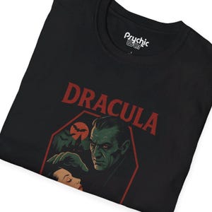 black shirt featuring Classic horror illustration of Dracula, coffin, bats, castle, bat