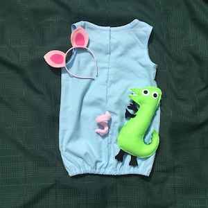 Peppa pigs brother George Pig inspired costume Peppa Pig&#39;s brother.  Also available, sold separately, are toy Dino and pig ears